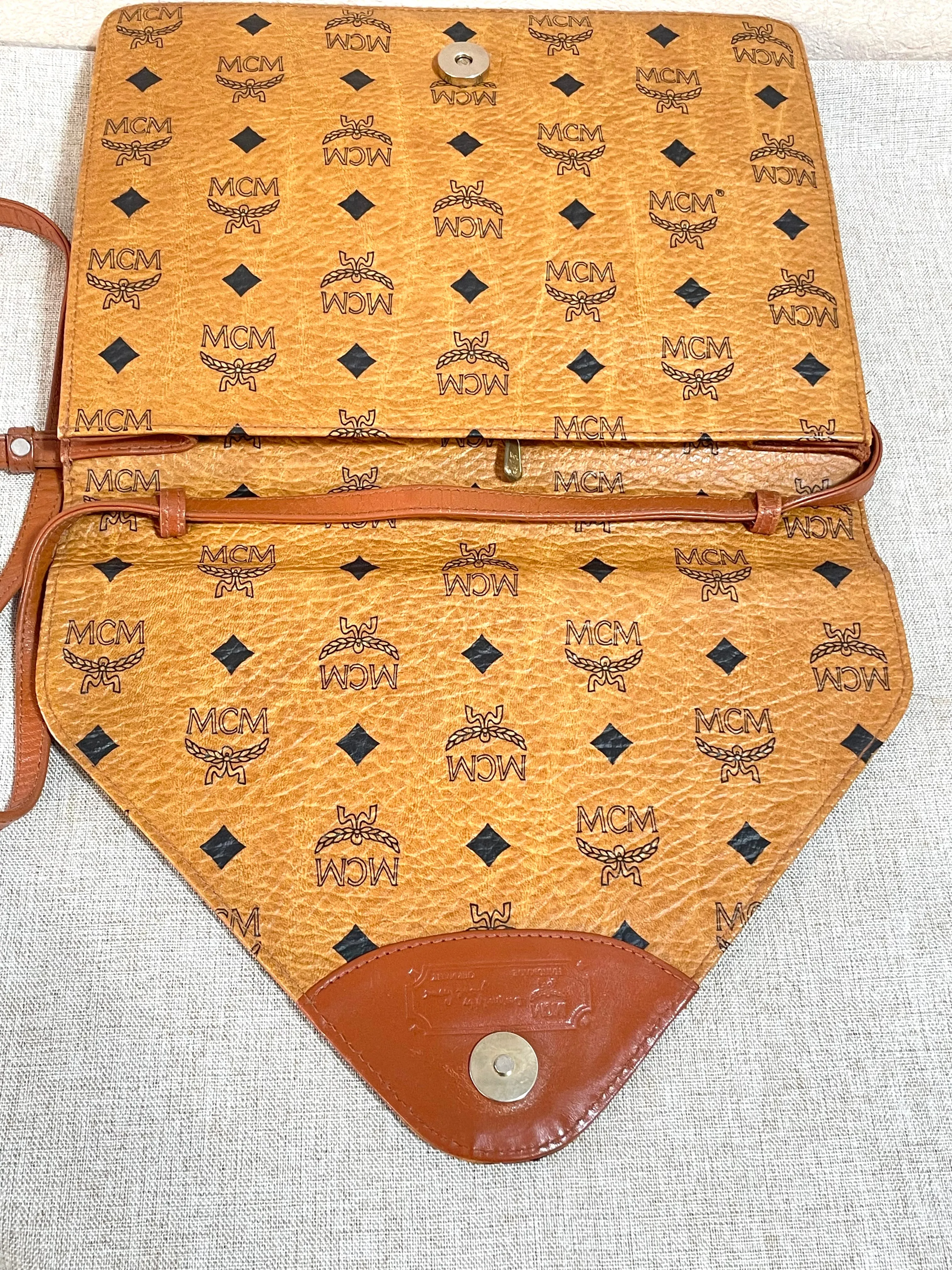 1990s. Vintage MCM brown monogram shoulder bag in envelop design. Designed by Michael Cromer. Can be a clutch bag too. 061217ac2