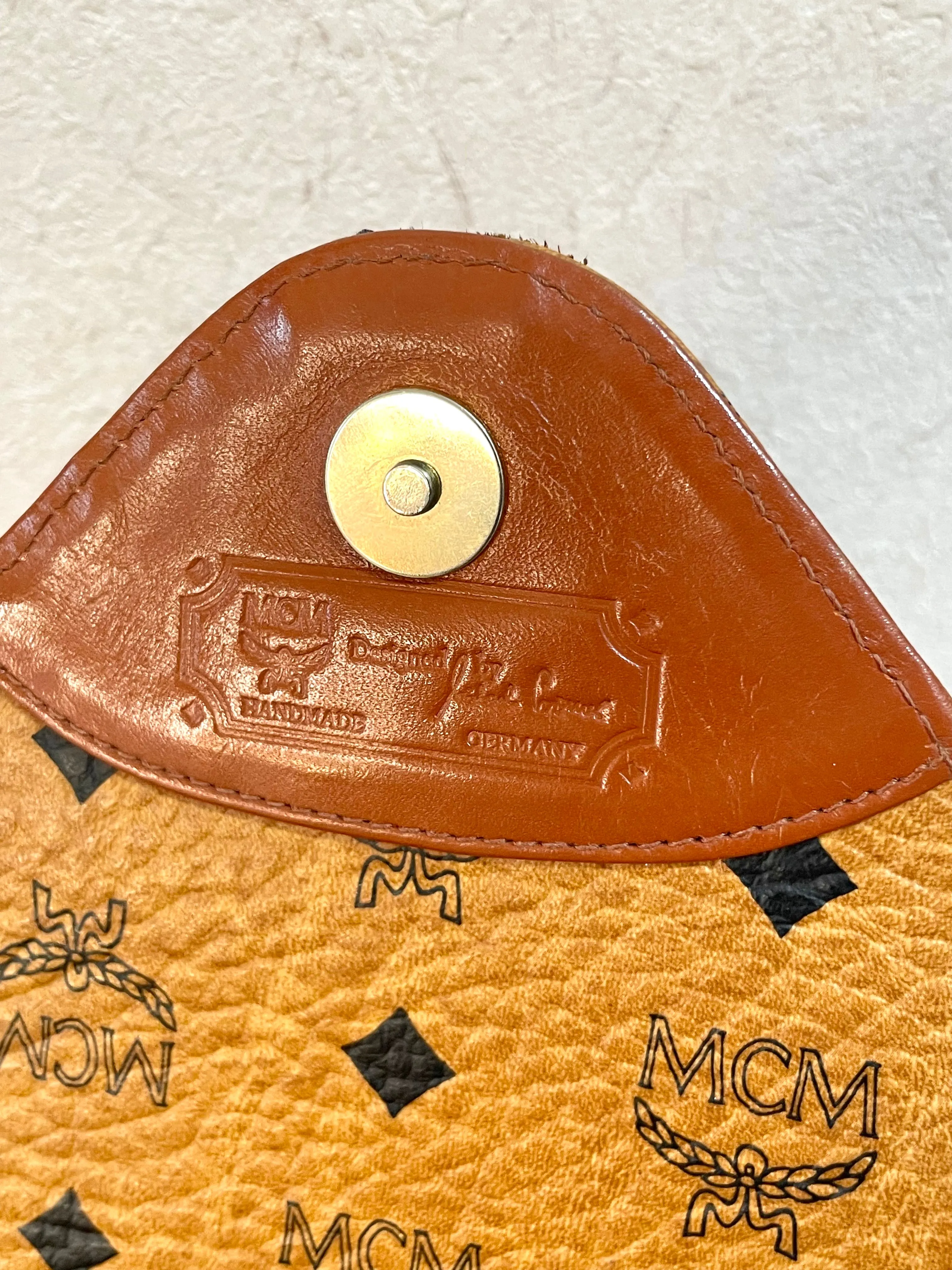 1990s. Vintage MCM brown monogram shoulder bag in envelop design. Designed by Michael Cromer. Can be a clutch bag too. 061217ac2
