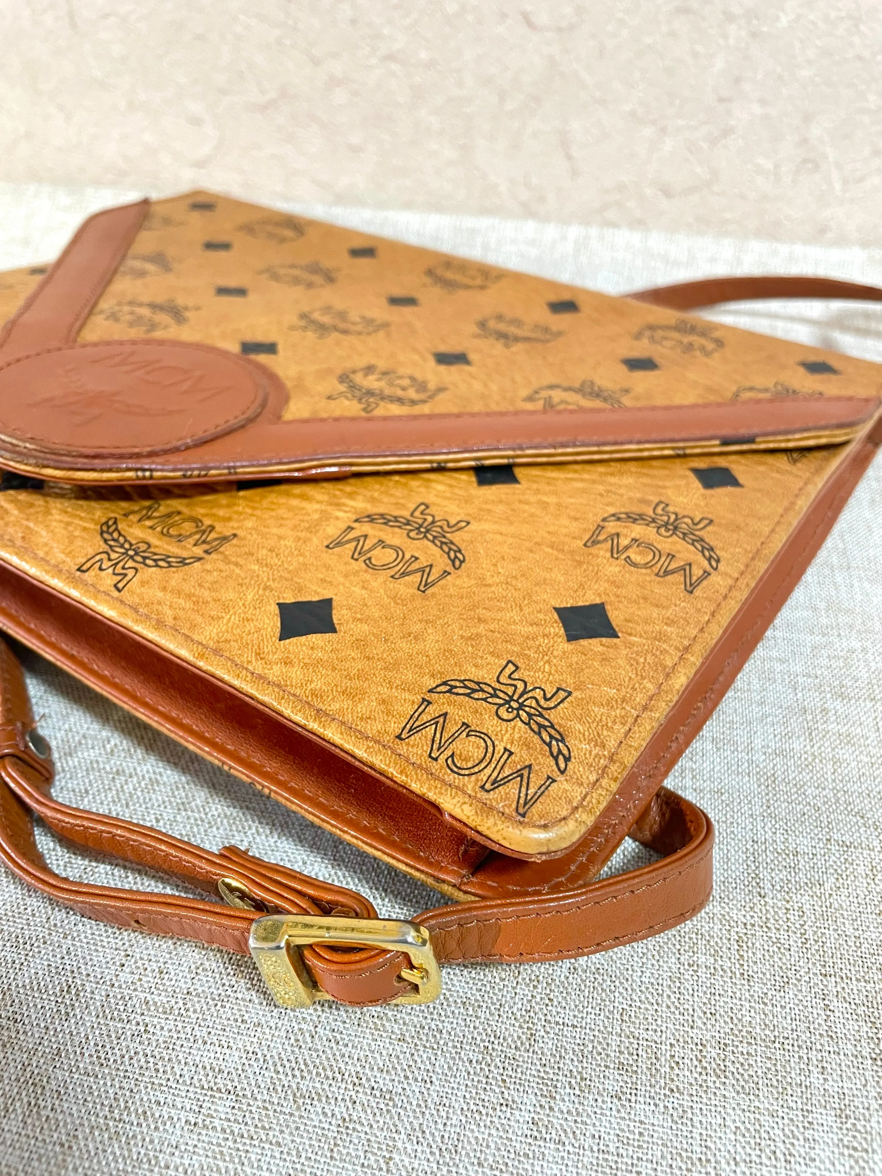 1990s. Vintage MCM brown monogram shoulder bag in envelop design. Designed by Michael Cromer. Can be a clutch bag too. 061217ac2