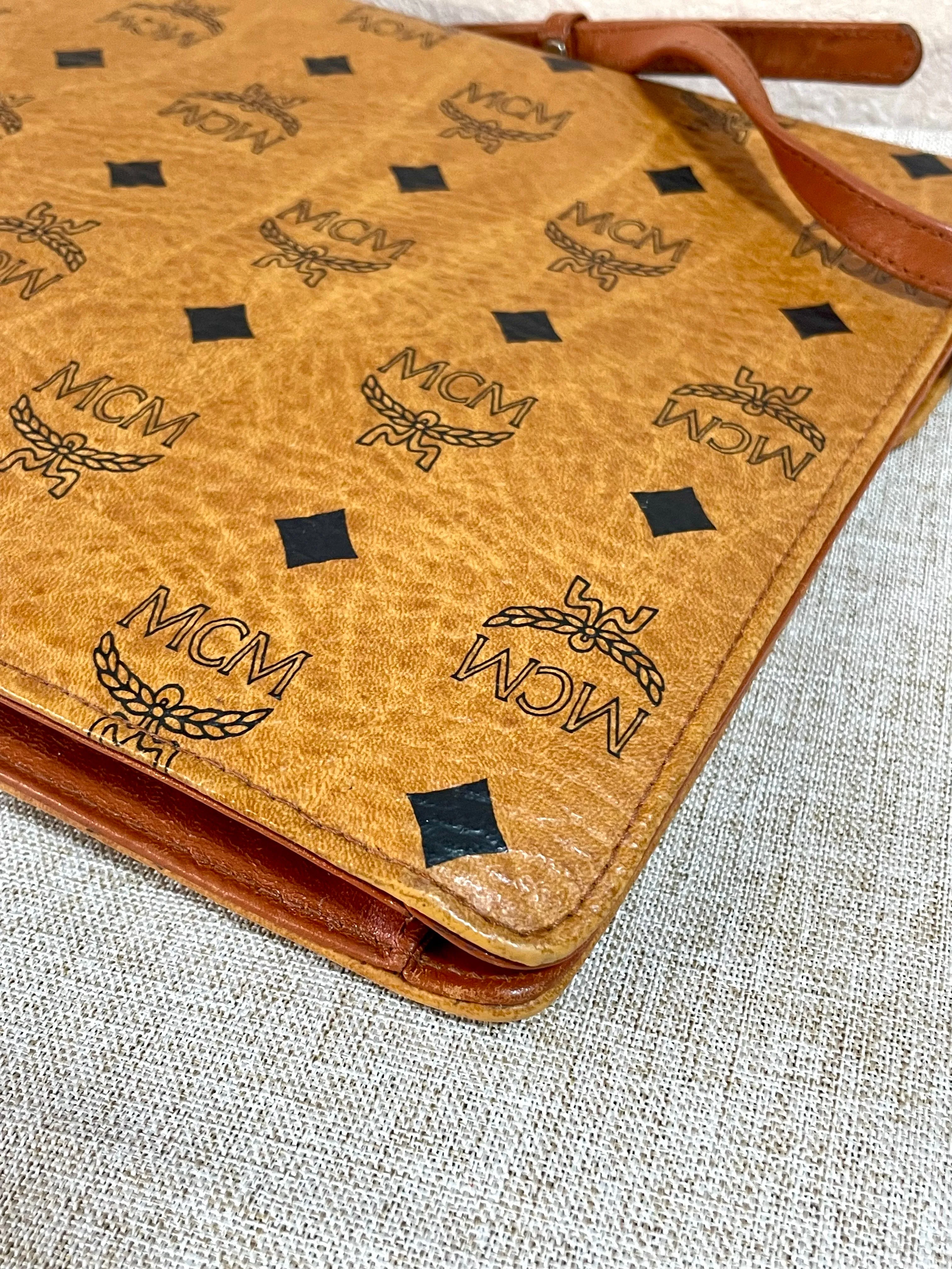 1990s. Vintage MCM brown monogram shoulder bag in envelop design. Designed by Michael Cromer. Can be a clutch bag too. 061217ac2
