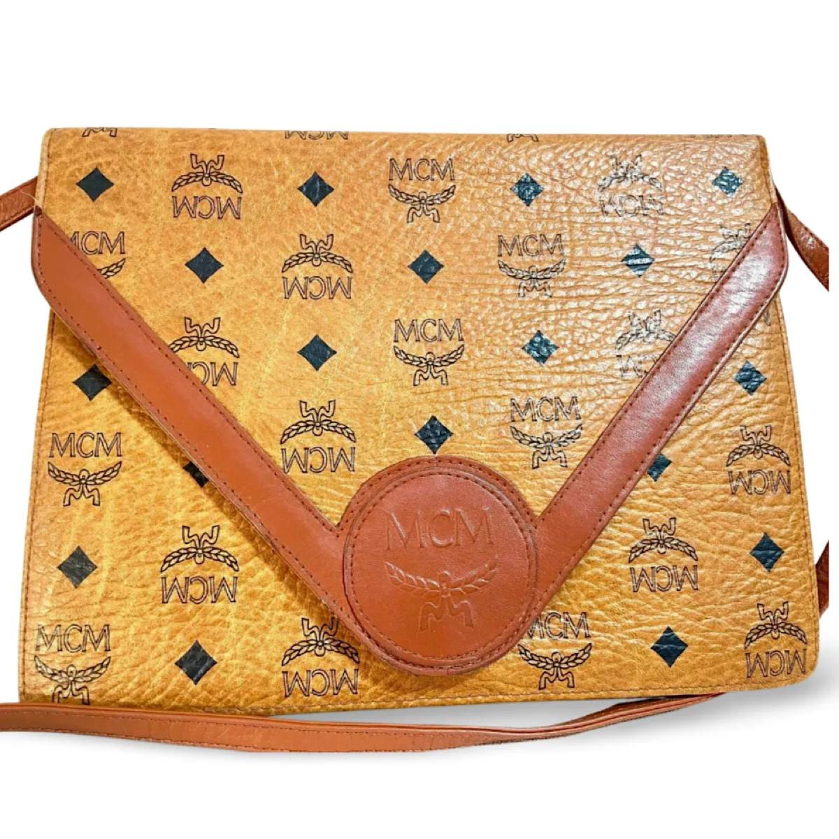 1990s. Vintage MCM brown monogram shoulder bag in envelop design. Designed by Michael Cromer. Can be a clutch bag too. 061217ac2
