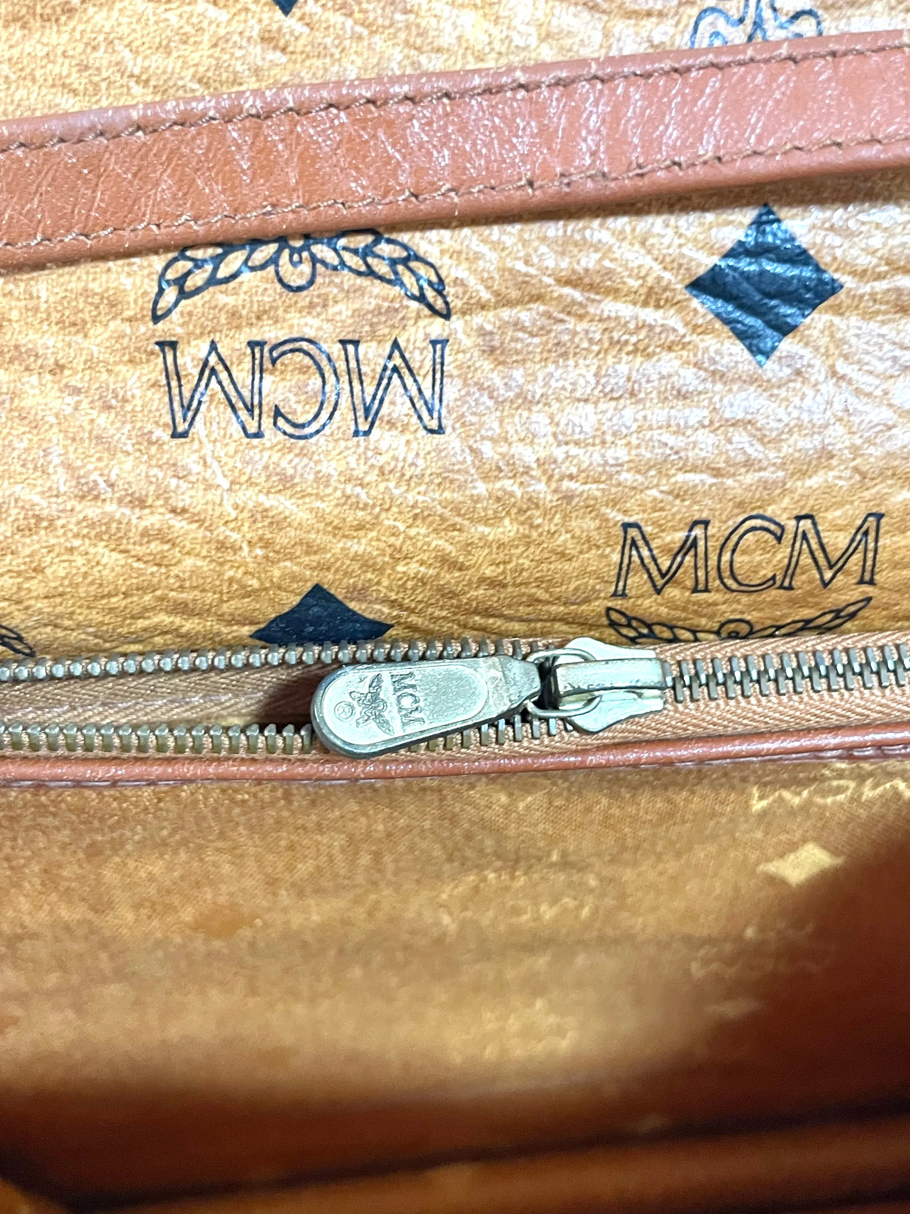 1990s. Vintage MCM brown monogram shoulder bag in envelop design. Designed by Michael Cromer. Can be a clutch bag too. 061217ac2