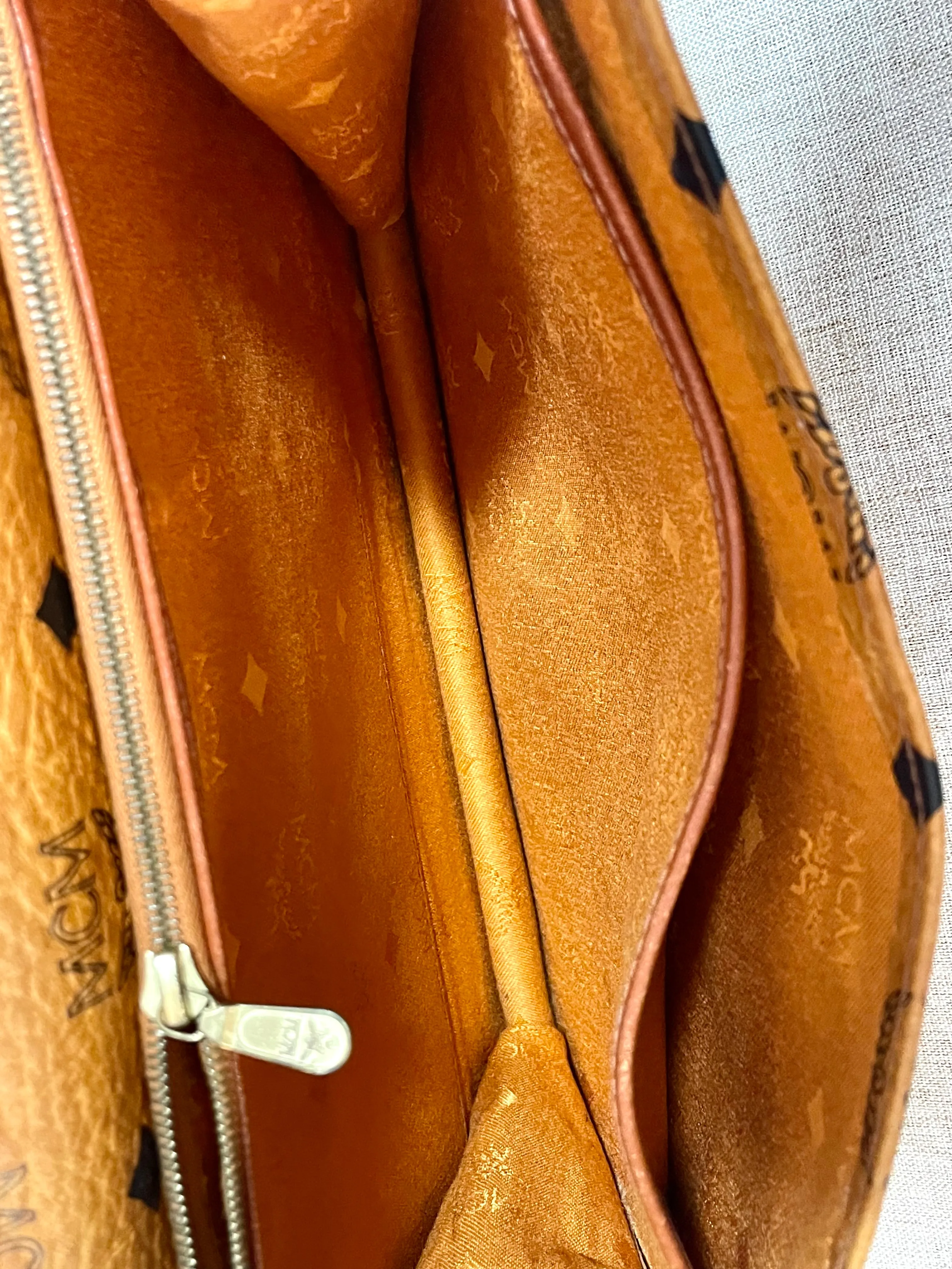 1990s. Vintage MCM brown monogram shoulder bag in envelop design. Designed by Michael Cromer. Can be a clutch bag too. 061217ac2