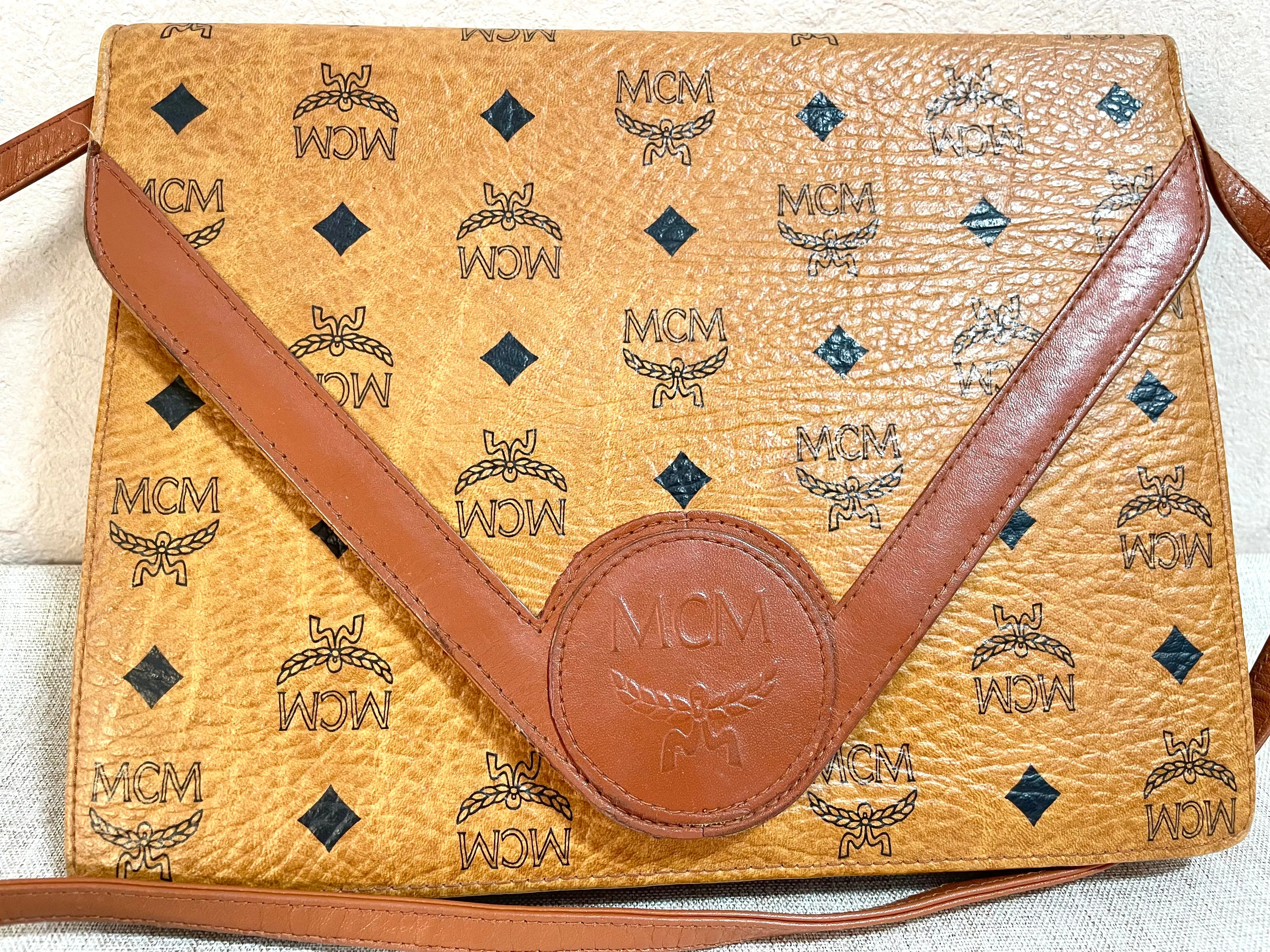 1990s. Vintage MCM brown monogram shoulder bag in envelop design. Designed by Michael Cromer. Can be a clutch bag too. 061217ac2
