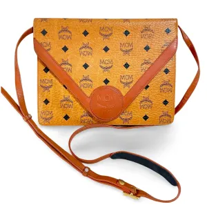 1990s. Vintage MCM brown monogram shoulder bag in envelop design. Designed by Michael Cromer. Can be a clutch bag too. 061217ac2